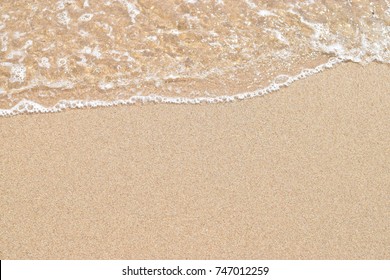 Soft Wave Of Ocean On Sandy Beach. Nature Background. Flat Lay Concept. Place For Your Text