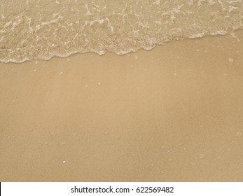 Soft Wave On The Sandy Beach Background