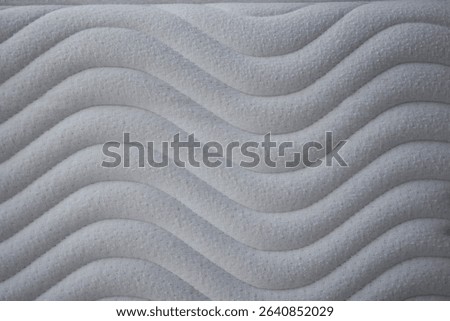 Soft wave pattern mattress closeup 