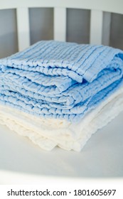 Soft White Blue Muslin Blanket On The Cot Closeup