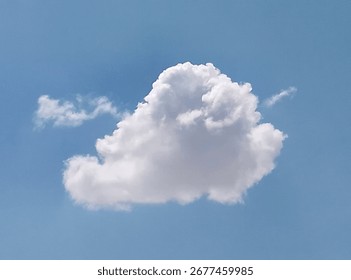 
A soft white cloud in the middle of the clear blue sky, giving the scene a sense of calm and serenity.