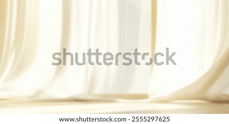 Soft white curtains gently flutter in a sunlit room.