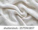 Soft white fabric draped elegantly showcasing a textured, lightweight weave perfect for various crafts and designs