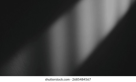 Soft white light casting a gentle shadow on a textured wall.