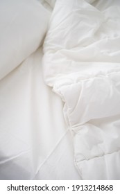 Soft White Pillows On Messy Bed, Closeup
