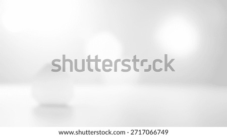 Soft White Sphere with Subtle Bokeh, Minimalist Studio Background, and Clean Ambient Light.