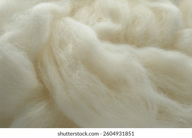 Soft white wool texture as background, closeup