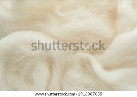 Soft white wool texture as background, closeup