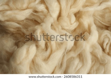 Soft white wool texture as background, closeup