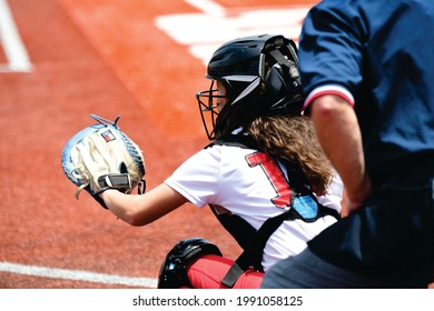 Softball Catcher In Front Of Umpire