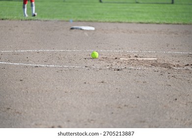 Softball and second base on a softball field