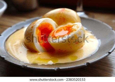 Soft-boiled eggs with mayonnaise sauce eaten at an Italian restaurant