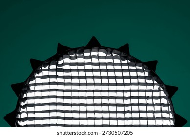 softbox with grids on an emerald background