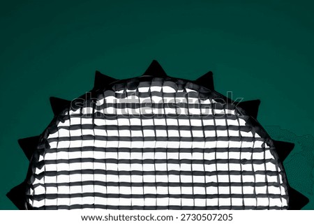 softbox with grids on an emerald background