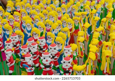 Soft-focus of Tò he figurines making by a craftsman in Vietnam Tet holidays market for children - Powered by Shutterstock