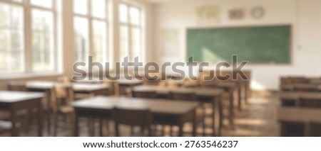 A soft-focus image of an empty classroom, featuring rows of wooden desks and chairs, with a green chalkboard visible in the background.