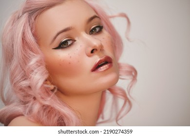 Soft-Girl Style With Trend Pink Flying Hair, Fashion Make-up. Blond Woman Face With Freckles, Blush Rouge, Rose Color