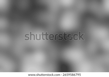 Softly blurred grayscale background creates a subtle and peaceful backdrop. The gradient of light and shadow generates a dreamy and ethereal aesthetic. Ideal for designs that require a touch of