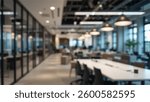A softly blurred office interior with large windows showcasing a stunning urban city view at sunset. Featuring elegant wooden desks, lush green plants, and warm lighting, creating a modern.