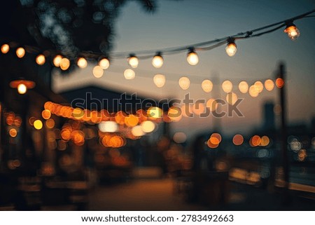 Softly glowing string lights create a magical atmosphere at dusk, perfect for outdoor events and celebrations.
