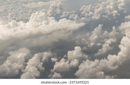 The softness of the clouds and sky with the light shining from the sun. Concept idea of Imaginative clouds nature, Clouds view from airplane, Space for text, No focus, specifically.