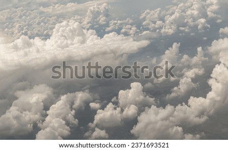 The softness of the clouds and sky with the light shining from the sun. Concept idea of Imaginative clouds nature, Clouds view from airplane, Space for text, No focus, specifically.
