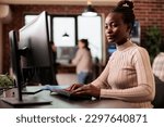 Software developer brainstorming ideas to write code and create new interface in data room. Tech enginner sitting at desk programming server database, working in busy it agency.