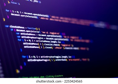 The software developer is doing javascript coding. Abstract code background. Selective focus code on computer screen