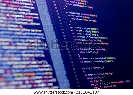 The software developer is doing php coding. Abstract code background. Selective focus code on computer screen