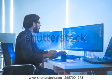 A software developer or financial analyst working late, coding on multiple screens and a foldable device. Concept for FinTech, app development, and stock trading algorithms.