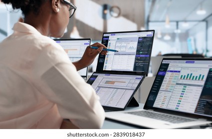 Software Developer Monitors API Gateway Logs Using Dual Touchscreen Laptops.
