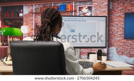 Software developer at PC coding, creating software, implementing algorithms. IT expert in home office working with code editor, building applications, optimizing performance, camera B panning shot