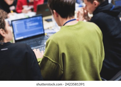 Software developer students in auditorium hall working on computer and laptop, programming contest hackathon competition, pc with coding program app, competitive programming for software engineer