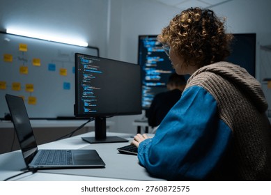 software developer talk strategy plan to executive write prompt AI bot IT app program data analytics in tech startup office.Projected visuals and glowing code on screen.AI chatbot technology concept