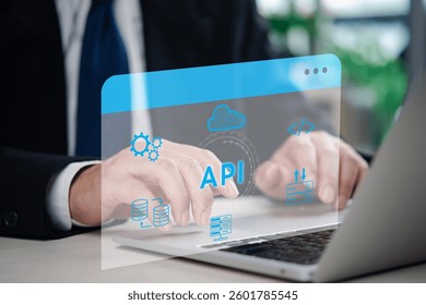 A software developer working on an API integration project with database and cloud services, demonstrating digital transformation in IT. Programming code and cloud computing visual elements.
