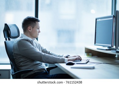 Software developer working on project in office - Shutterstock ID 761152438