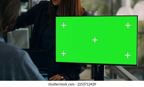 Software developers working on code programming with greenscreen on computer, using terminal window and chromakey isolated display. Looking at mockup copyspace template in app coding space.