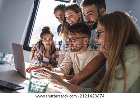 Software developing workers at a meeting  in conference room. They discuss future projects.