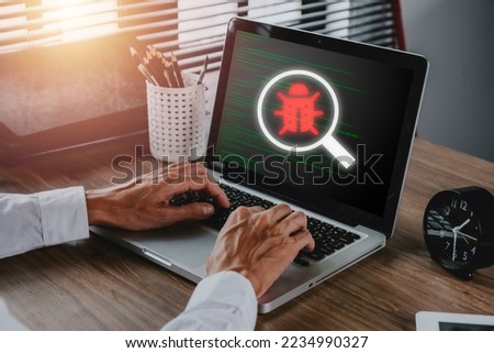 Software development and debugging concept, Person hand using laptop computer with bug software icon on screen, Software security, Computer bug, failure or error of software.