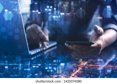 Software development, Internet technology, IoT concept. Double exposure, coding software developer working on mobile smart phone, laptop computer and city, binary, technology elements virtual screen