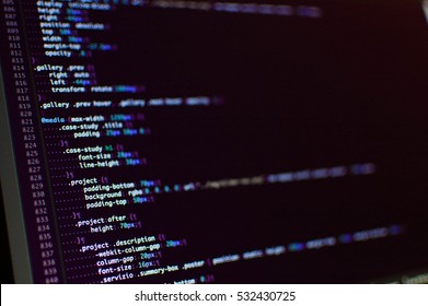 Software development. Software source code. Programming code. Writing programming code on laptop.