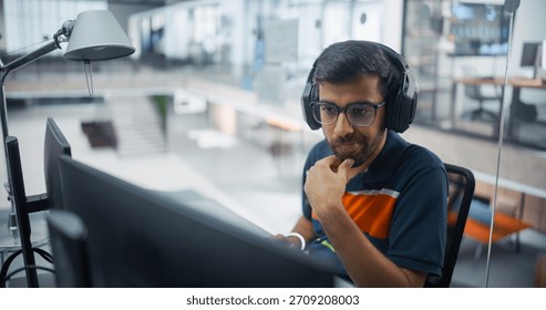 Software Engineer With Headphones Meticulously Codes Ai Applications on Dual Screens in Office. Emphasizes Technical Mastery, Programming Precision, Innovative Artificial Intelligence Development.