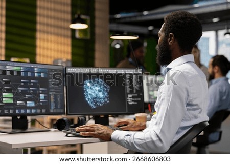 Software engineer leverages AI language model assistance while coding in artificial intelligence company office. Startup programmer integrates LLM chatbot suggestions into code editor
