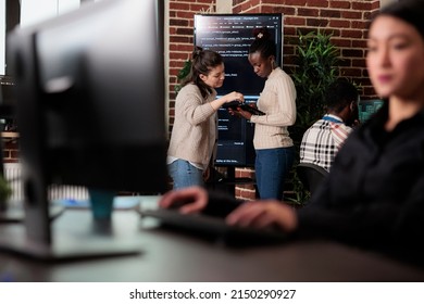 Software Engineers Trying To Solve Storage Space Problem By Using Advanced Artificial Intelligence. Multiracial Developer Team Talking About Rising Number Of System Security Breaches.