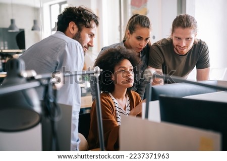 Software engineers working on project and programming in company