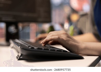 Software expert at workstation programming on pc and writing lines of code, using coding tools and a terminal window interface. Woman debugging software for web development. Close up.