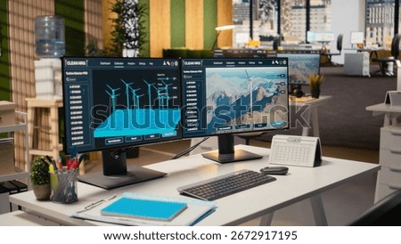 Software interface on PC used for planning wind farm layouts, determining optimal turbine placements. CAD program on computer in engineering office used to design windmills farm configurations