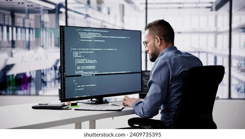 Software Programmer Or Coder Man Using Office Computer
