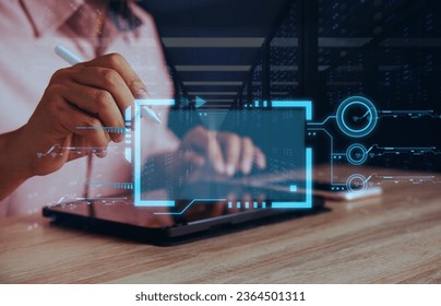 Software and programmers in the hologram coded on a tablet that thinks digital technology data analysis and overlapping at night programmers in 3D programming and cyber security research copying space - Powered by Shutterstock