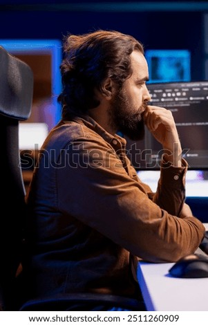 Software technician filtering malicious traffic from cybercriminals attempting to corrupt company data. IT admin working on computer, preventing malware and phishing attacks